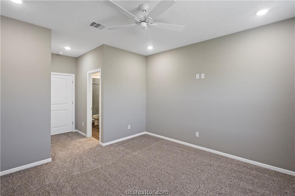 1245 Storm Row Lane Bryan, TX 77803 - Photo 12 of 23 an empty room with closet and a ceiling fan