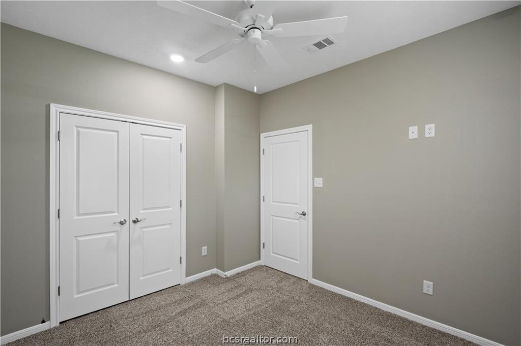 1245 Storm Row Lane Bryan, TX 77803 - Photo 16 of 23 an empty room with closet area