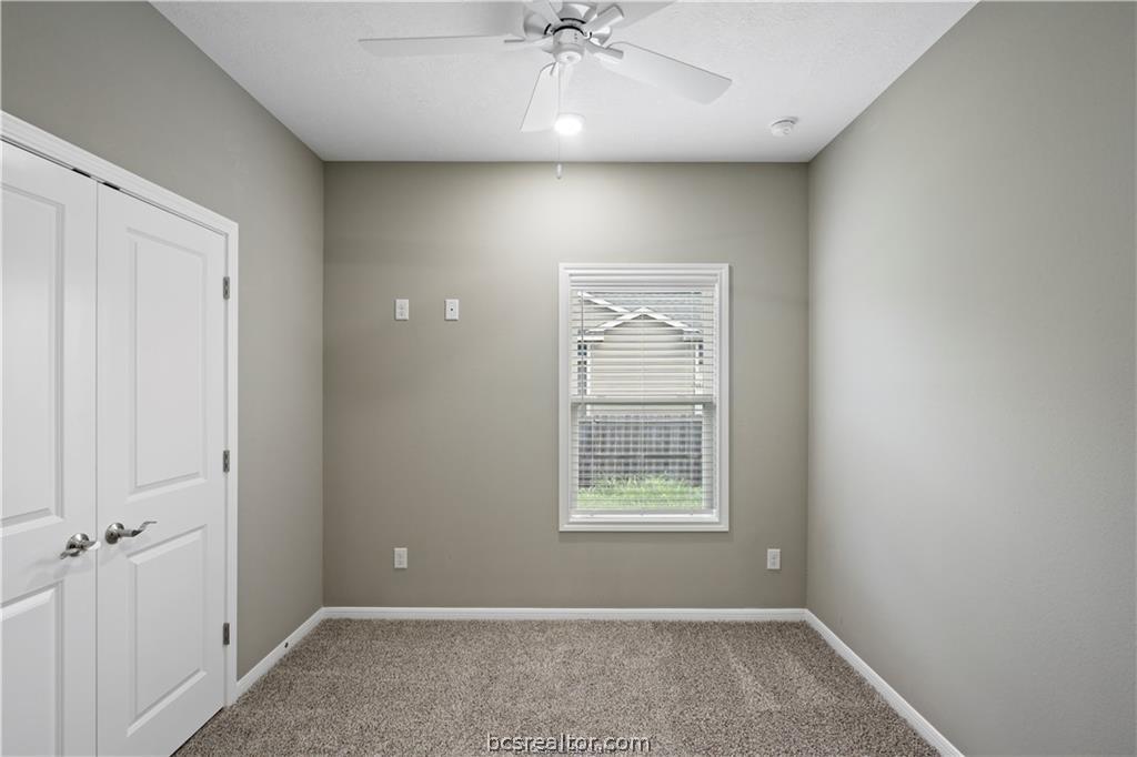 1245 Storm Row Lane Bryan, TX 77803 - Photo 17 of 23 an empty room with a window and closet