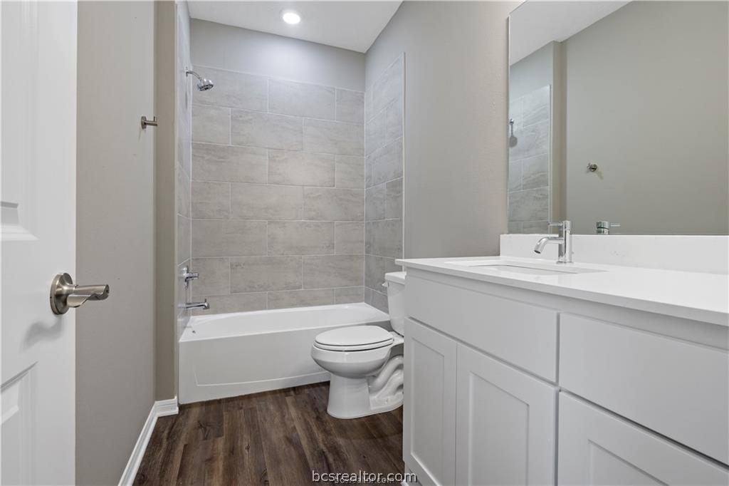 1245 Storm Row Lane Bryan, TX 77803 - Photo 19 of 23 a bathroom with a sink a toilet and shower