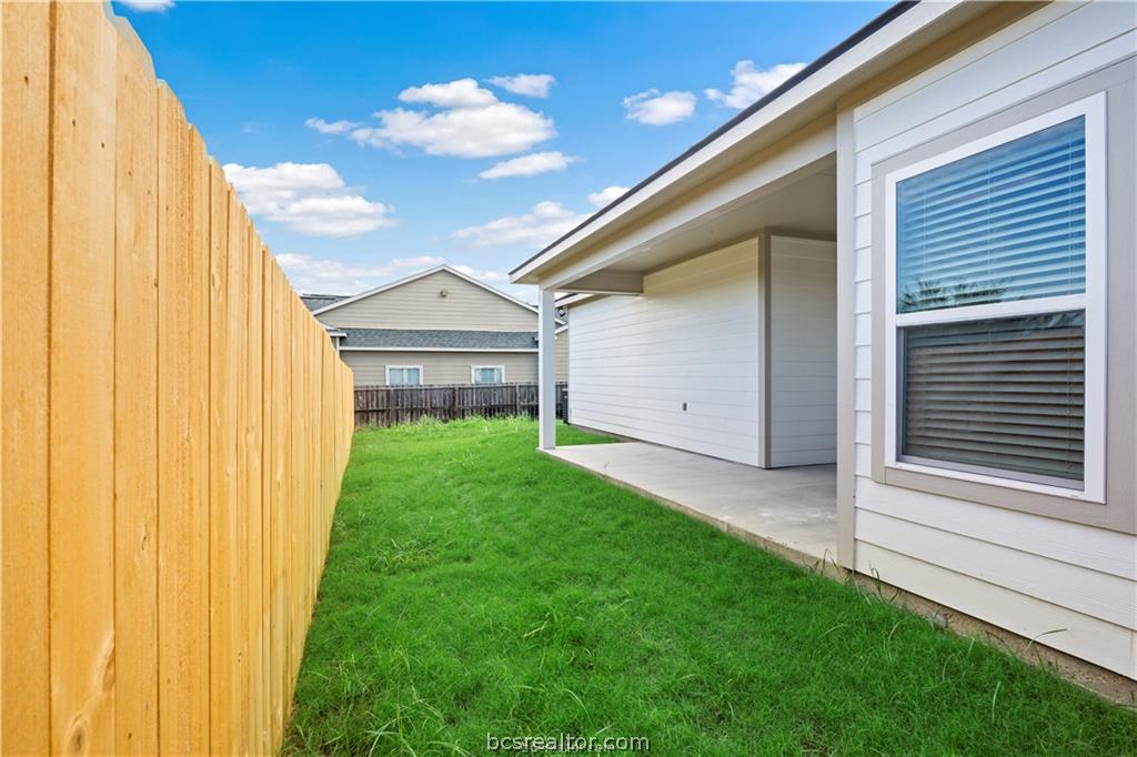 1245 Storm Row Lane Bryan, TX 77803 - Photo 20 of 23 a view of a back yard of the house