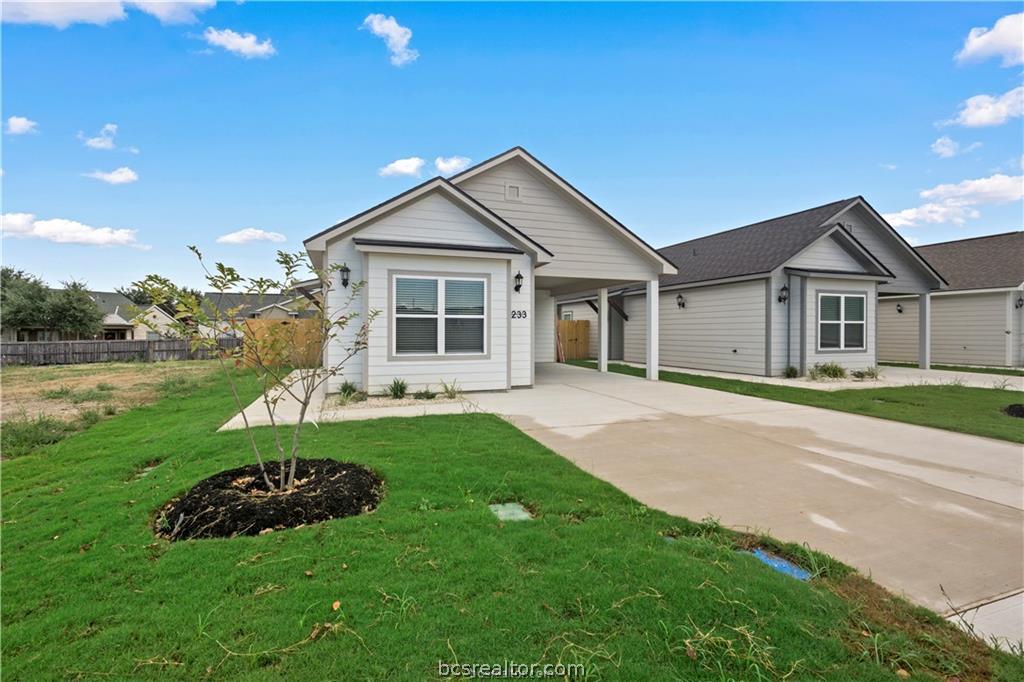 1245 Storm Row Lane Bryan, TX 77803 - Photo 2 of 23 a front view of a house with a yard