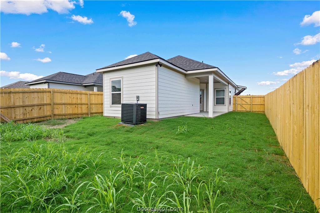 1245 Storm Row Lane Bryan, TX 77803 - Photo 21 of 23 a view of a house with backyard