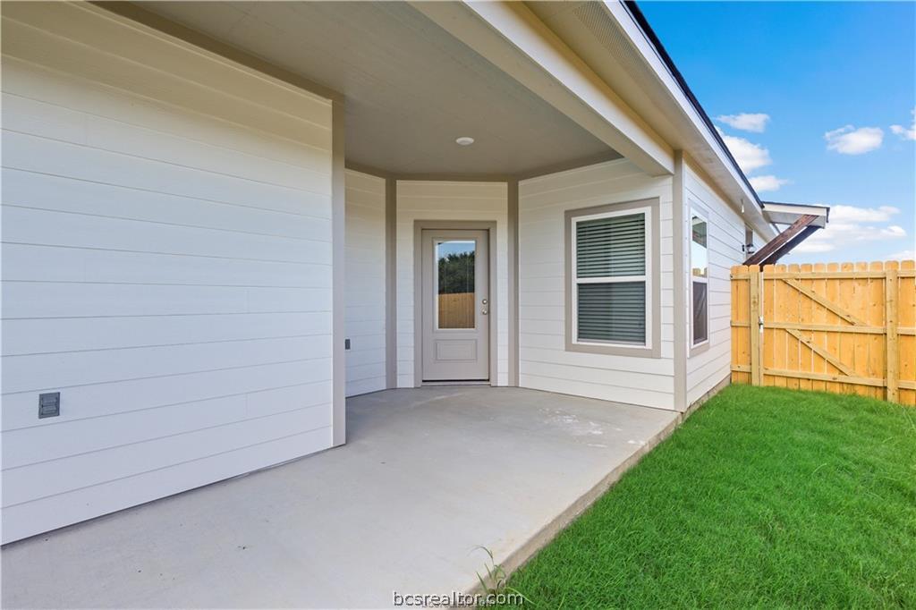 1245 Storm Row Lane Bryan, TX 77803 - Photo 23 of 23 a view of house with backyard and porch