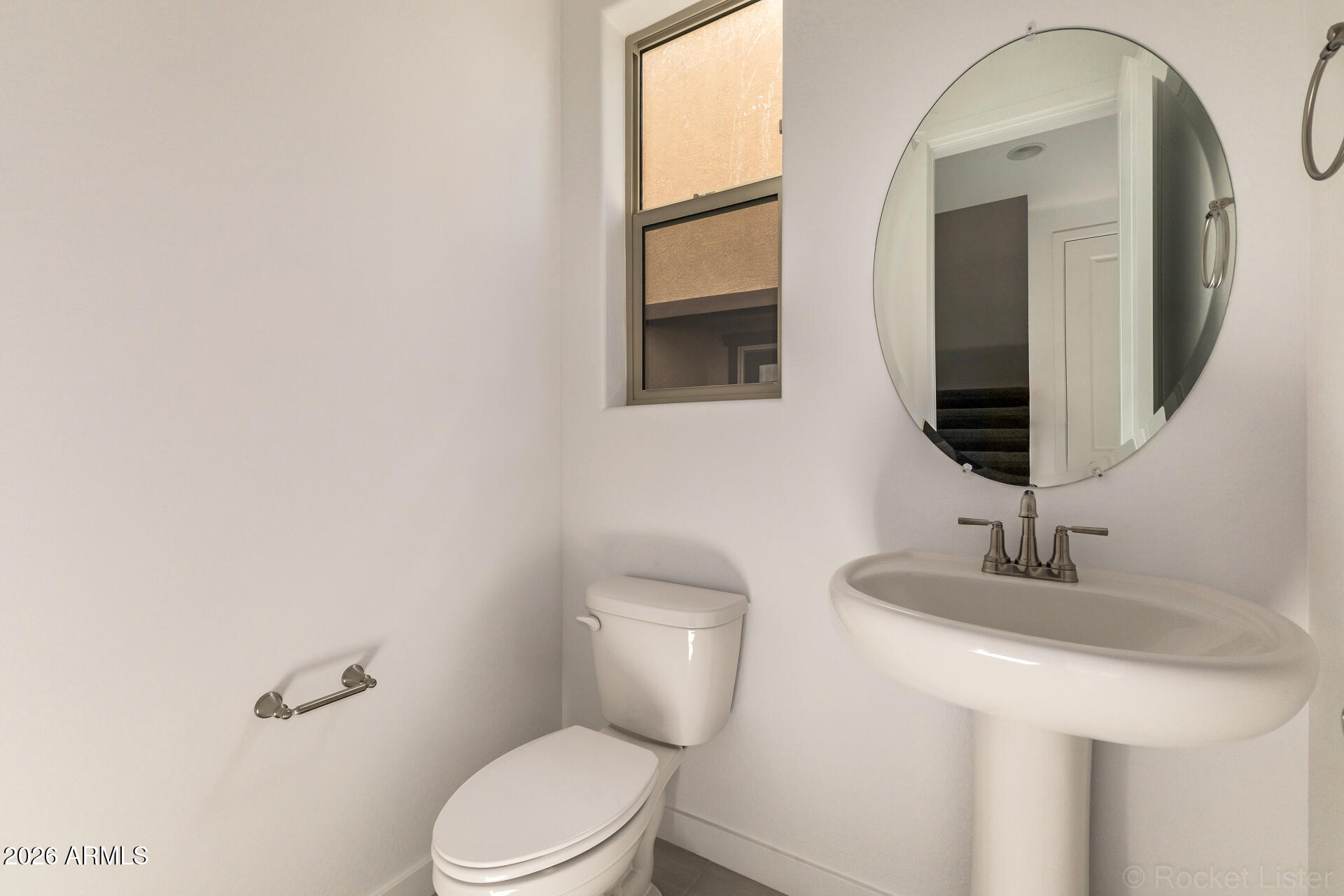 20618 West Thomas Road Buckeye, AZ 85396 - Photo 14 of 38 a bathroom with a toilet sink and mirror