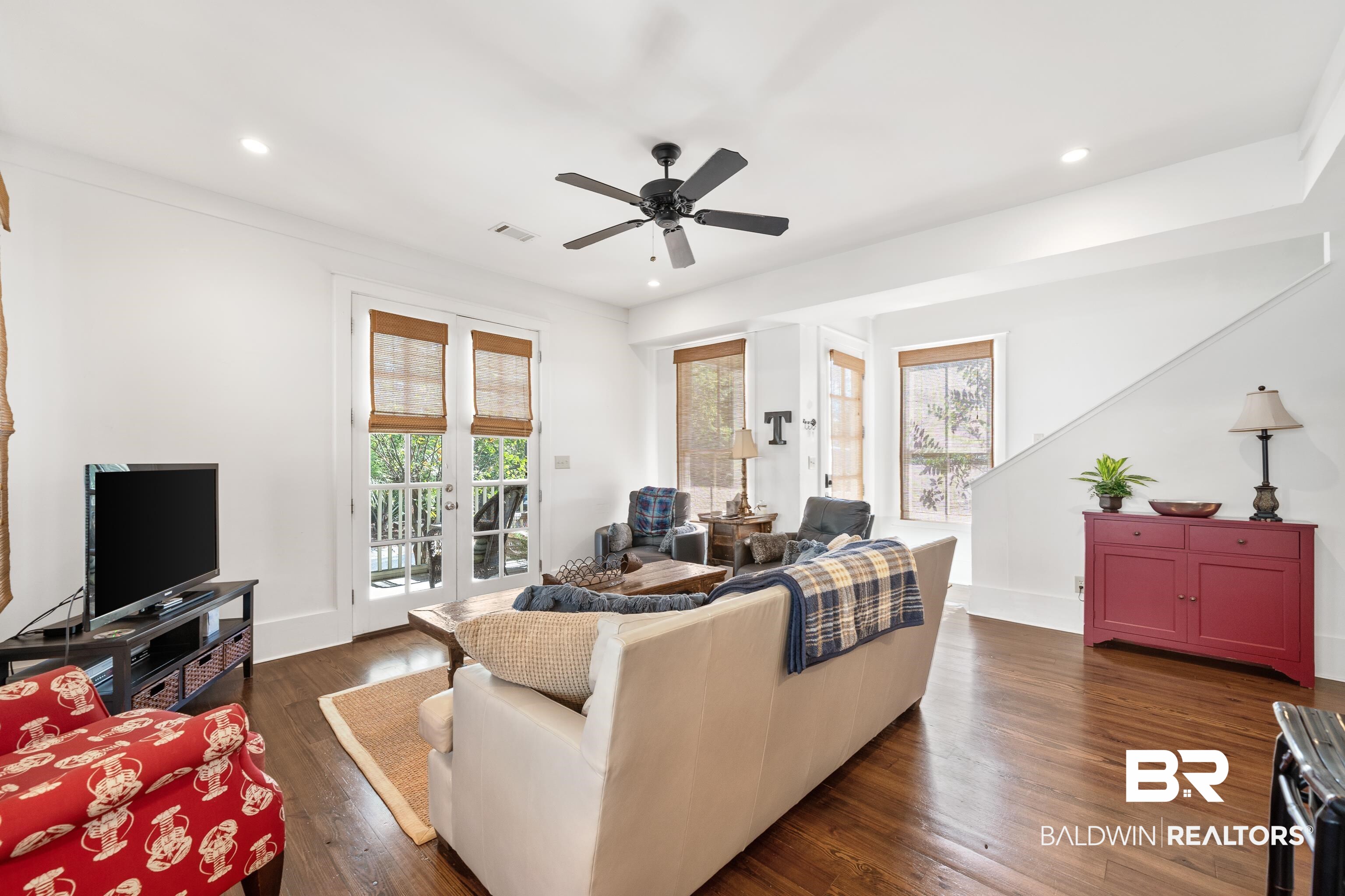 25773 Canal Road, Unit 10 Orange Beach, AL 36561 - Photo 5 of 40 Living room with french doors, beautiful hardwood floors, a wealth of natural light, and ceiling fan
