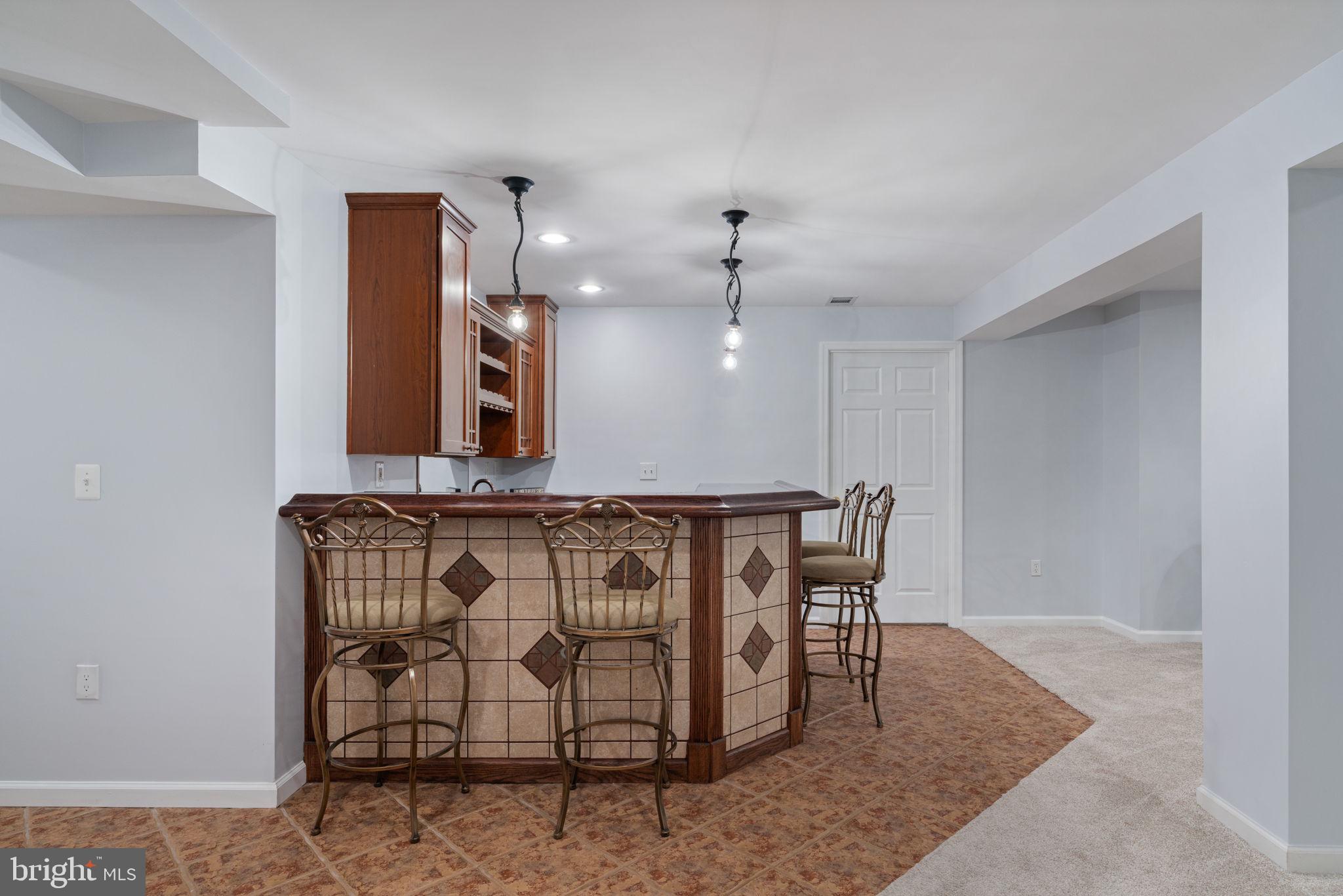 6472 Colonial Village Loop Manassas, VA 20112 - Photo 56 of 69 Sink, wine fridge, microwave