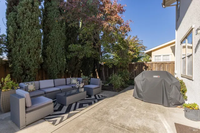 a view of a backyard with a patio