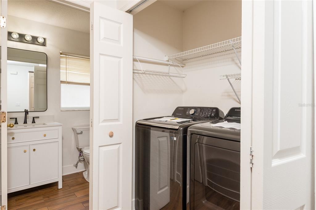 11813 Prickly Pear Way Seffner, FL 33584 - Photo 19 of 21 a utility room with sink dryer and washer