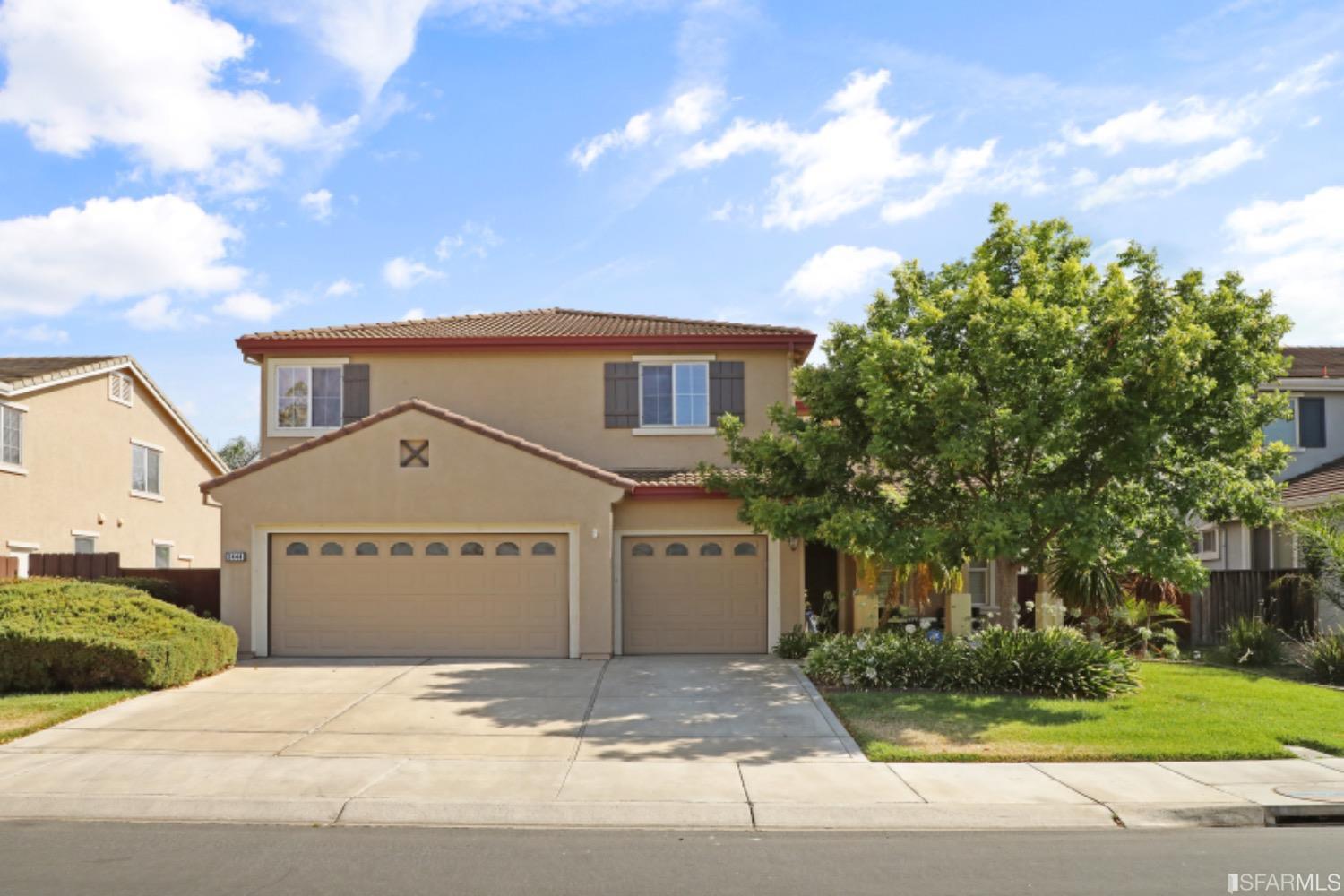 3444 Keystone Loop Discovery Bay, CA 94505 - Photo 1 of 40 a front view of a house with a yard and garage