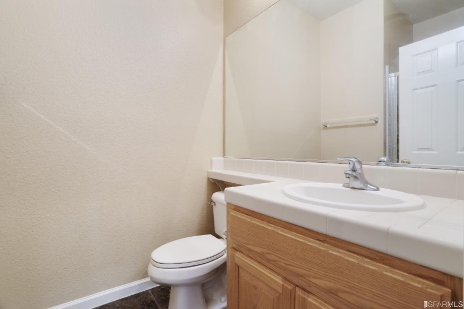 3444 Keystone Loop Discovery Bay, CA 94505 - Photo 13 of 40 a bathroom with a sink and a toilet
