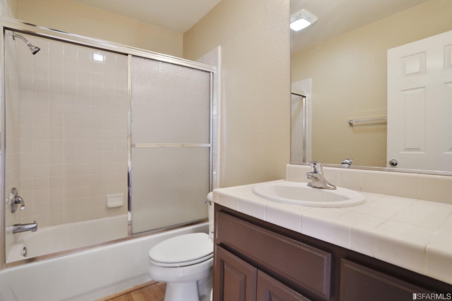 3444 Keystone Loop Discovery Bay, CA 94505 - Photo 19 of 40 a bathroom with a sink and a mirror