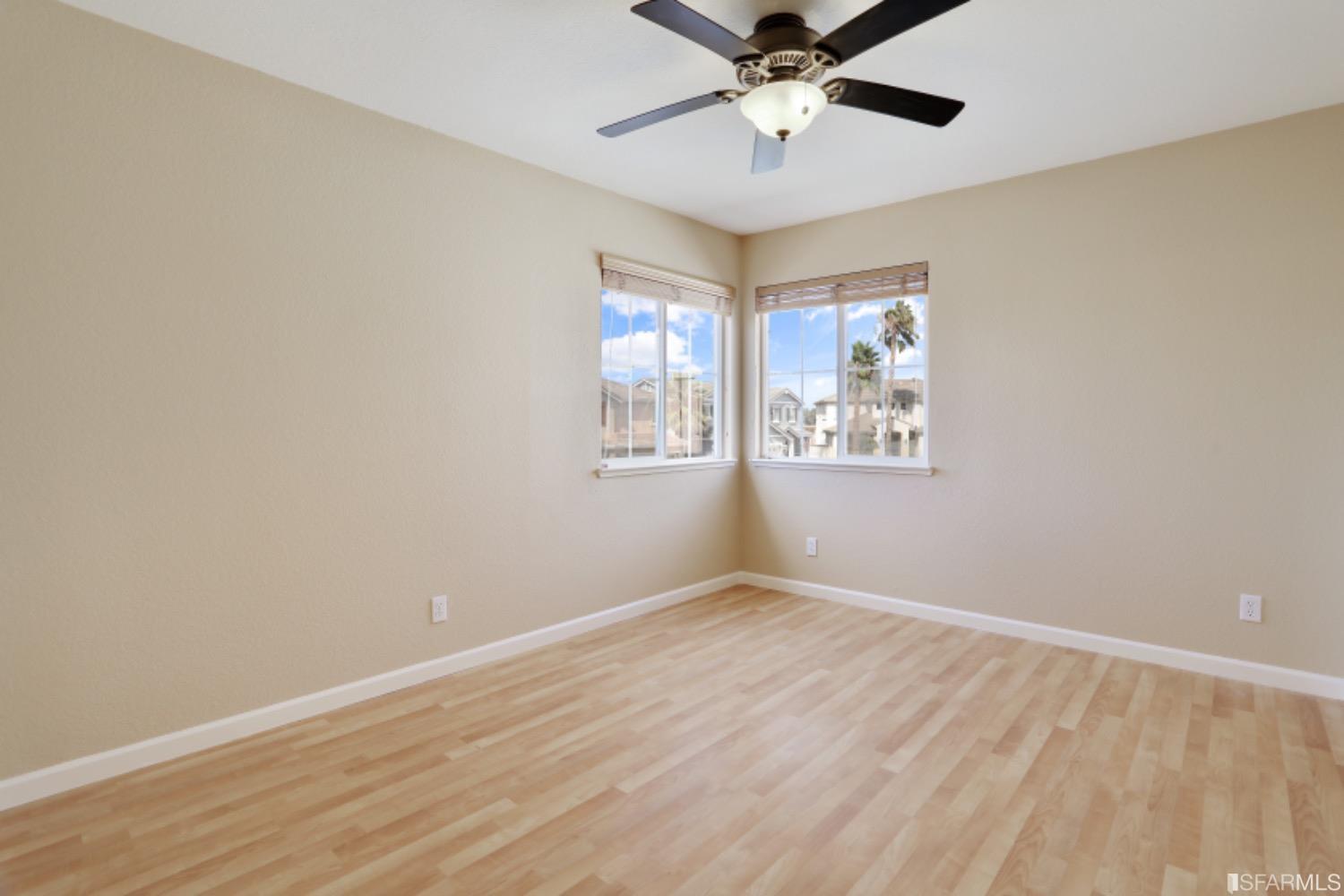 3444 Keystone Loop Discovery Bay, CA 94505 - Photo 20 of 40 wooden floor in an empty room with a window