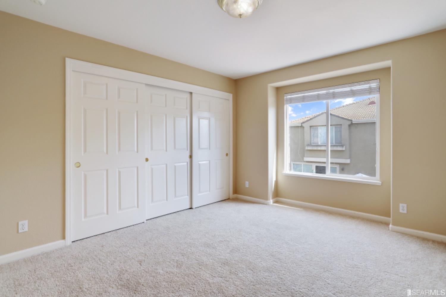 3444 Keystone Loop Discovery Bay, CA 94505 - Photo 26 of 40 an empty room with windows and closet