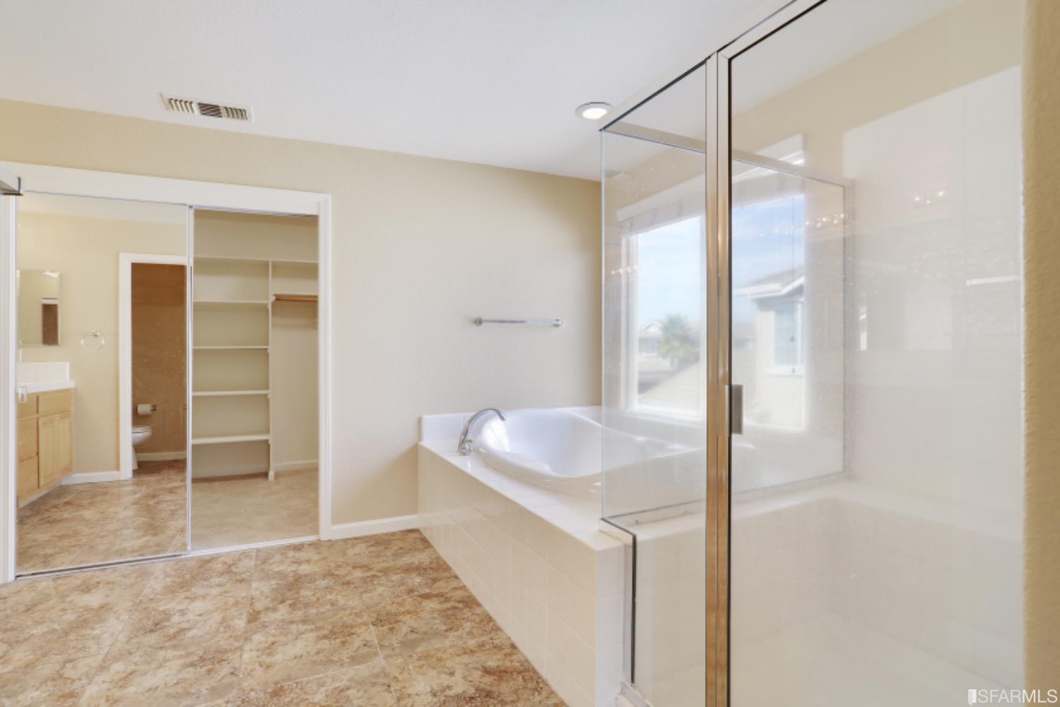 3444 Keystone Loop Discovery Bay, CA 94505 - Photo 29 of 40 a bathroom with a tub sink and shower