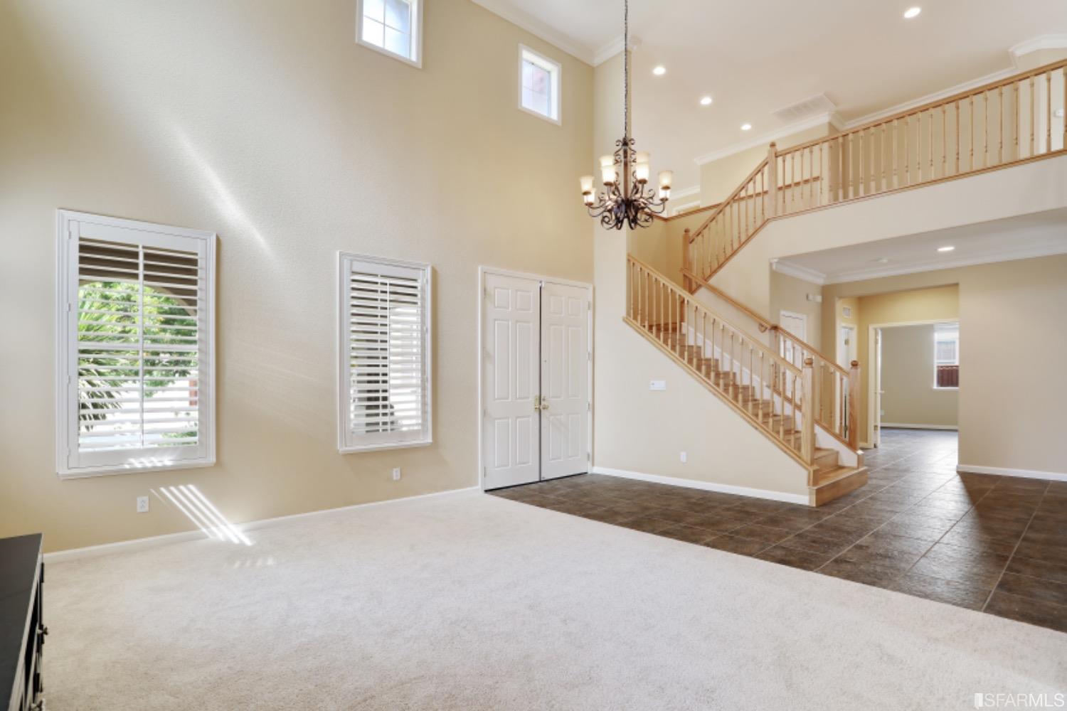 3444 Keystone Loop Discovery Bay, CA 94505 - Photo 5 of 40 a view of an empty room with a window and a chandelier