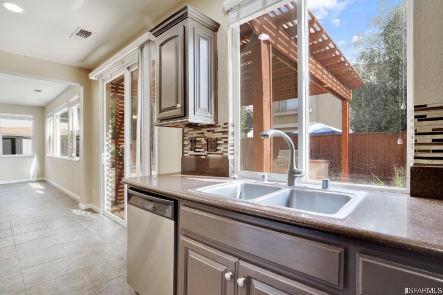 3444 Keystone Loop Discovery Bay, CA 94505 - Photo 9 of 40 a kitchen with a sink and a window