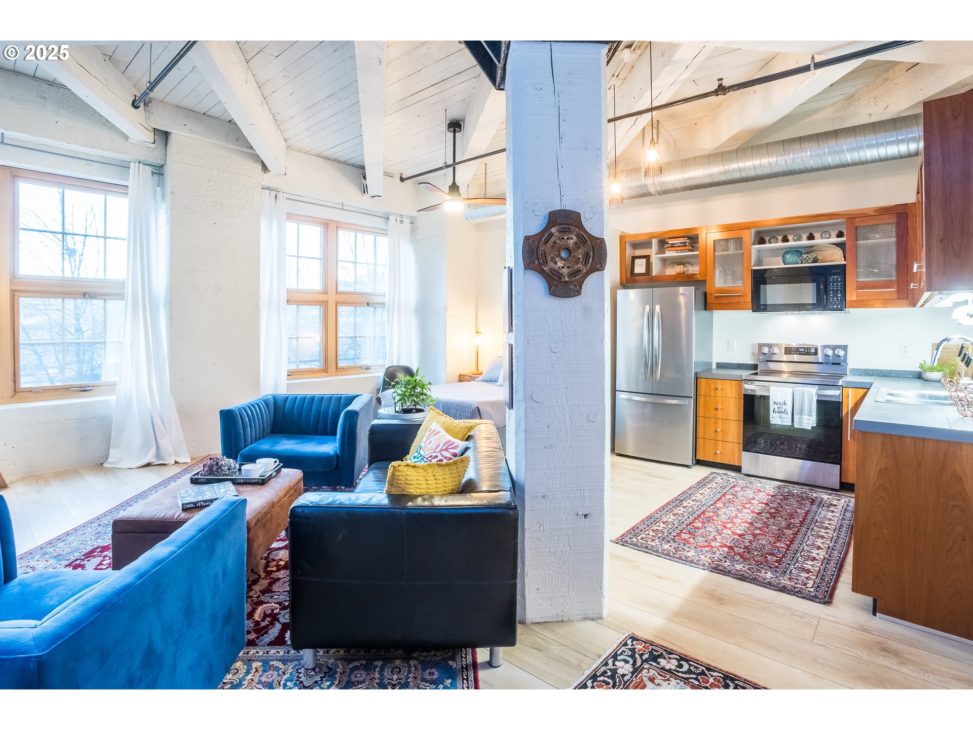 1420 Northwest Lovejoy Street, Unit 417 Portland, OR 97209 - Photo 13 of 40 a living room with furniture a rug and a window