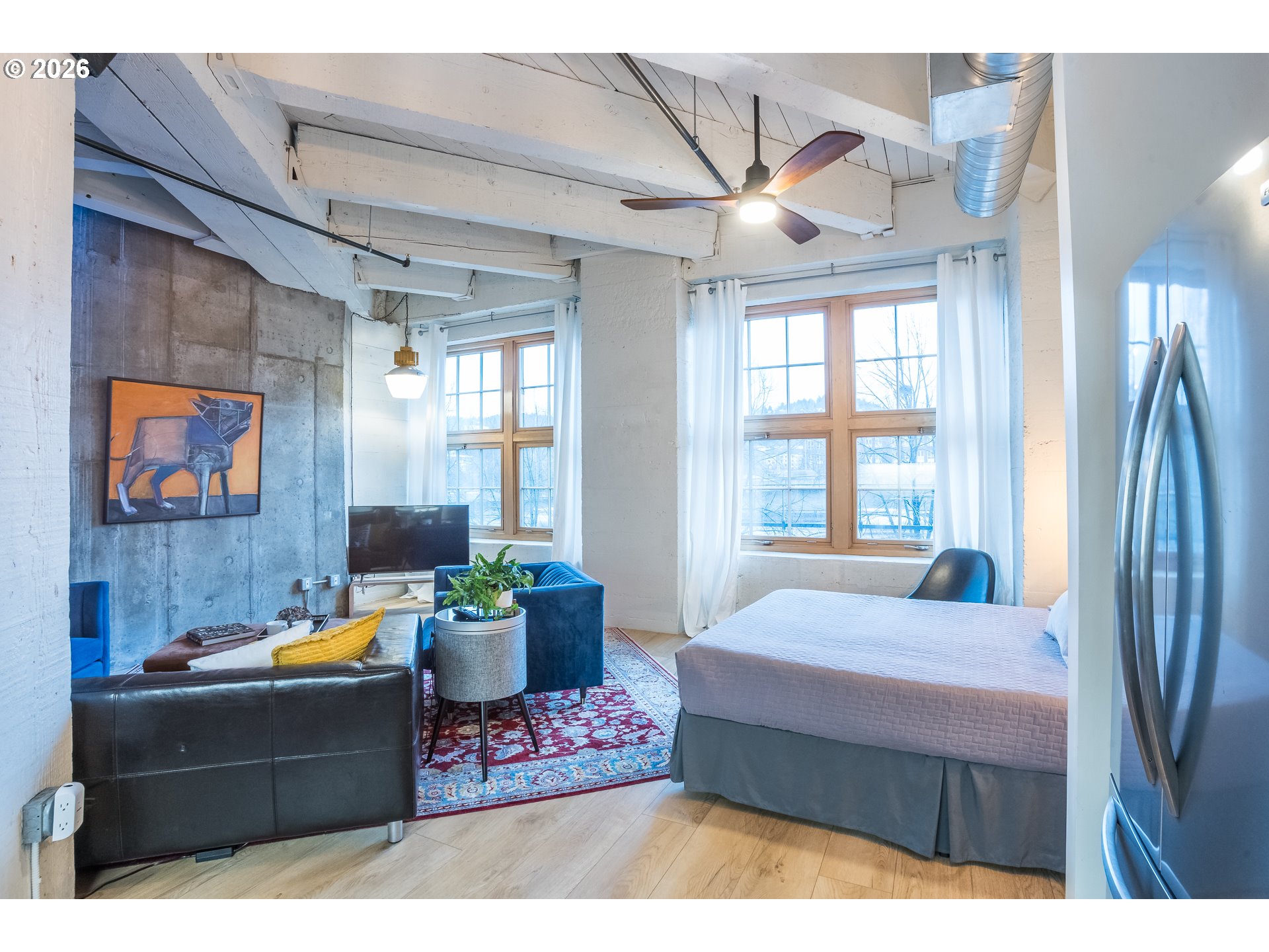 1420 Northwest Lovejoy Street, Unit 417 Portland, OR 97209 - Photo 22 of 40 a living room with furniture and a window