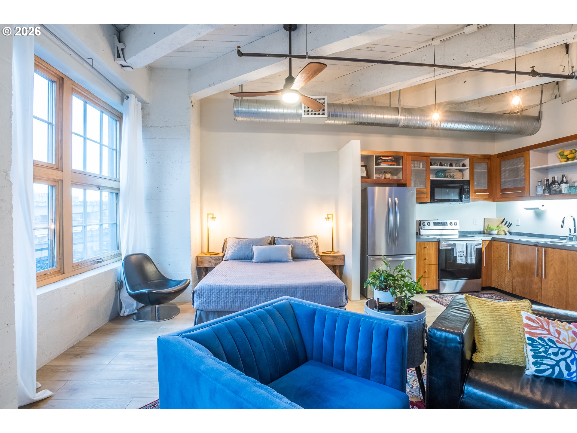 1420 Northwest Lovejoy Street, Unit 417 Portland, OR 97209 - Photo 24 of 40 a living room with a couch and a table