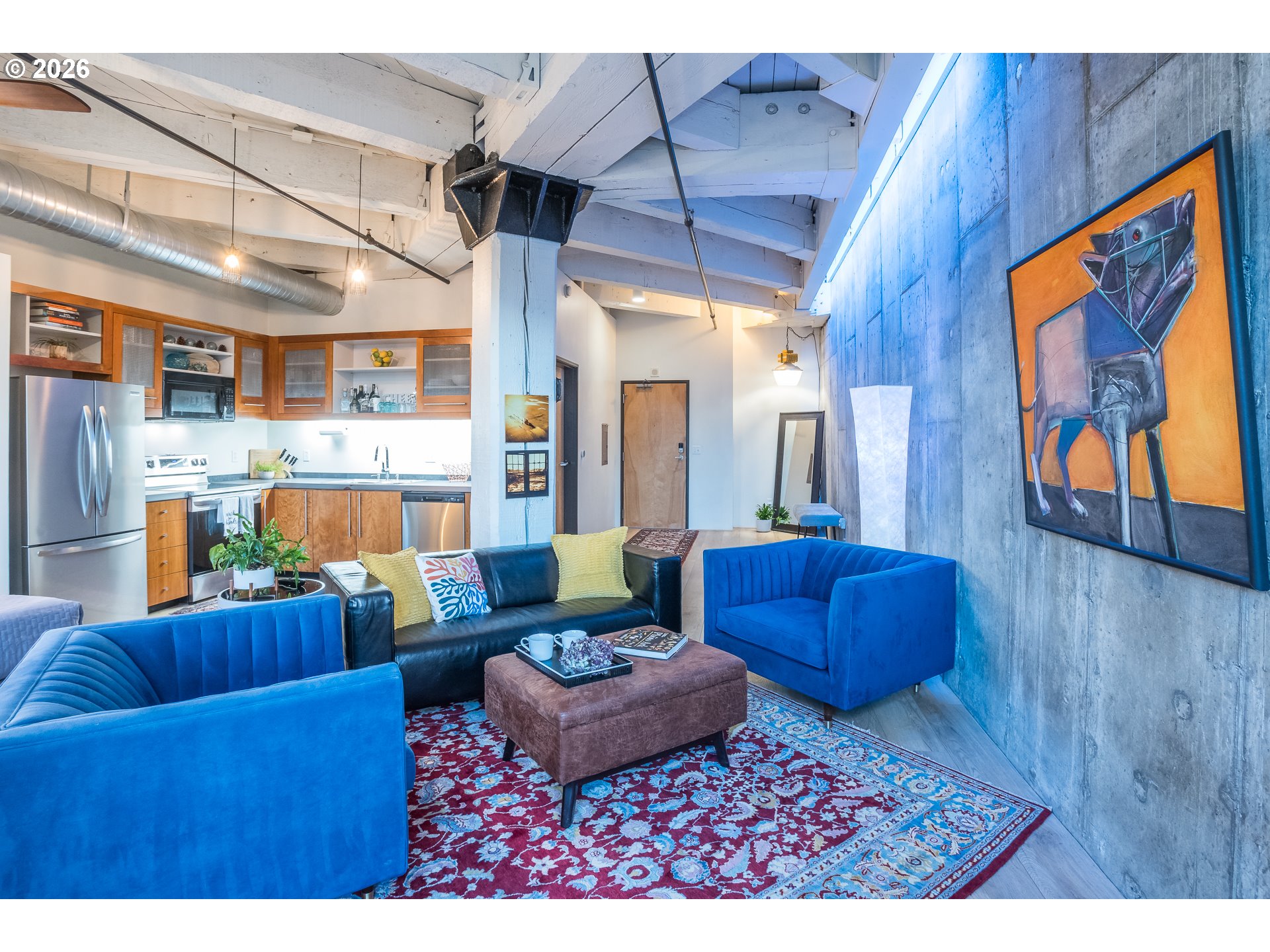 1420 Northwest Lovejoy Street, Unit 417 Portland, OR 97209 - Photo 25 of 40 a living room with furniture and a rug