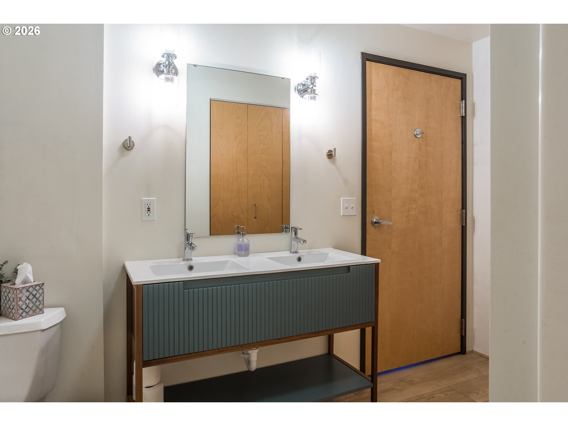 1420 Northwest Lovejoy Street, Unit 417 Portland, OR 97209 - Photo 28 of 40 a view of bathroom with a sink and mirror