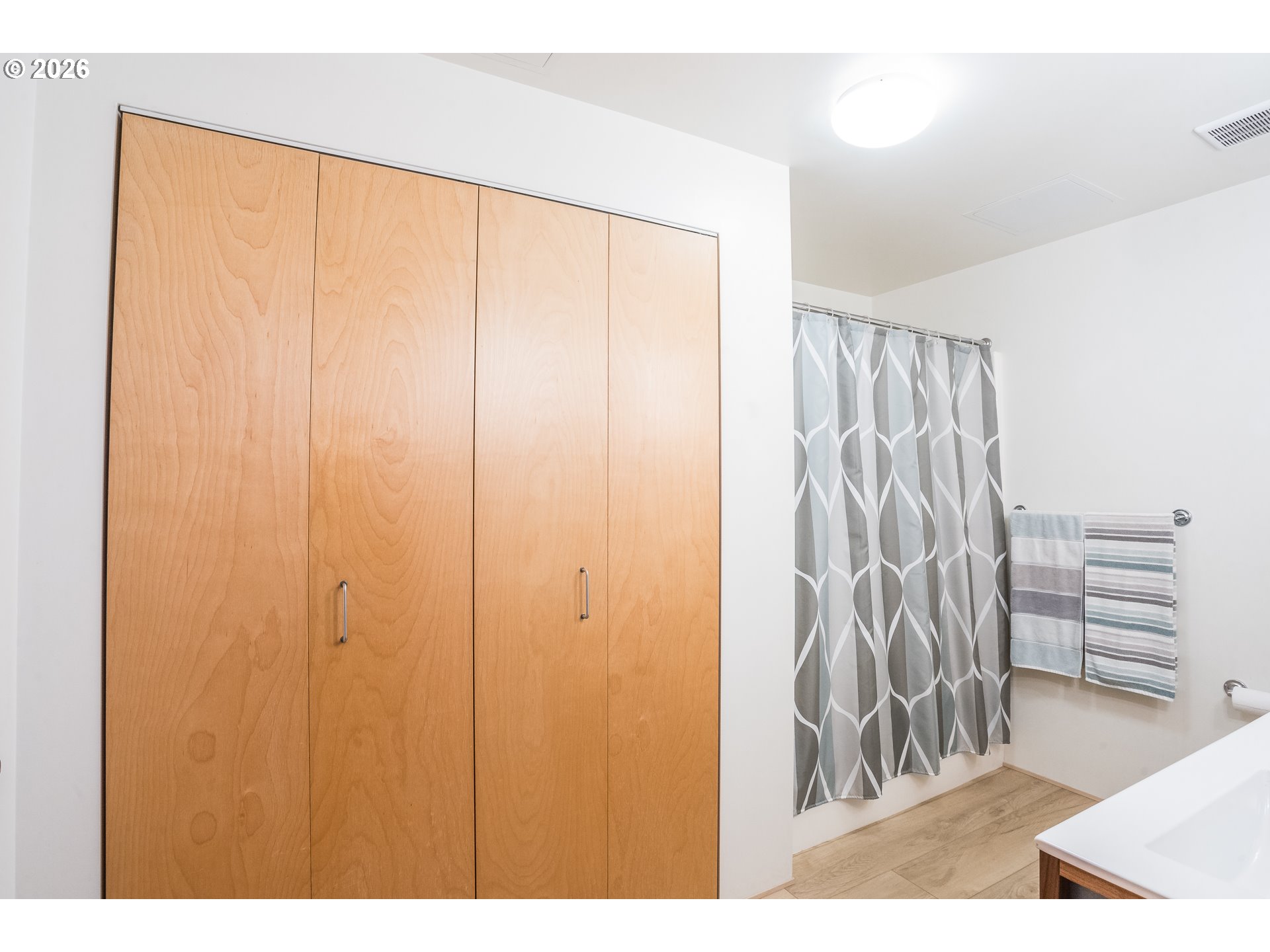 1420 Northwest Lovejoy Street, Unit 417 Portland, OR 97209 - Photo 29 of 40 a view of wooden floor with a curtain