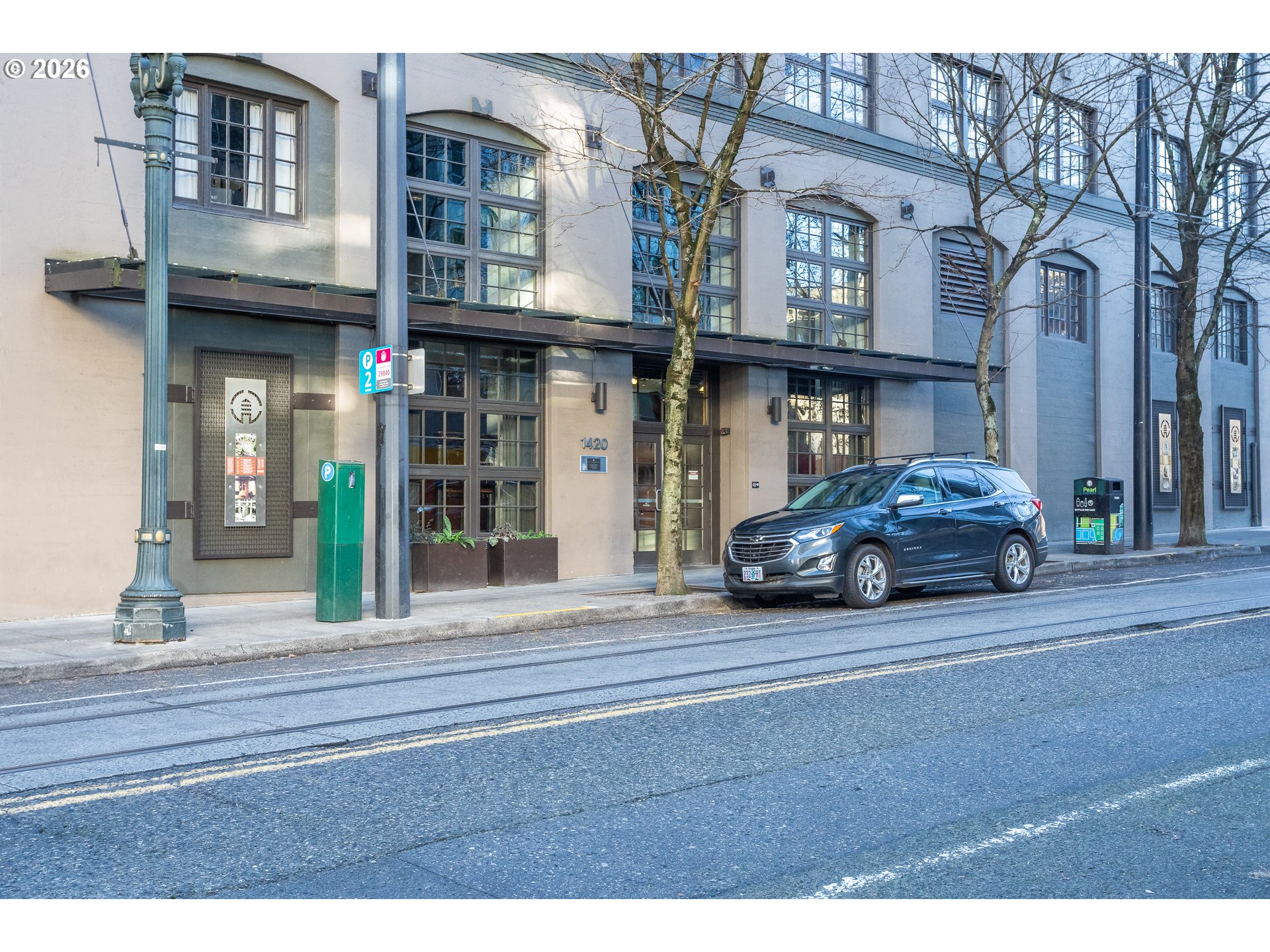 1420 Northwest Lovejoy Street, Unit 417 Portland, OR 97209 - Photo 3 of 40 a car parked in front of a building