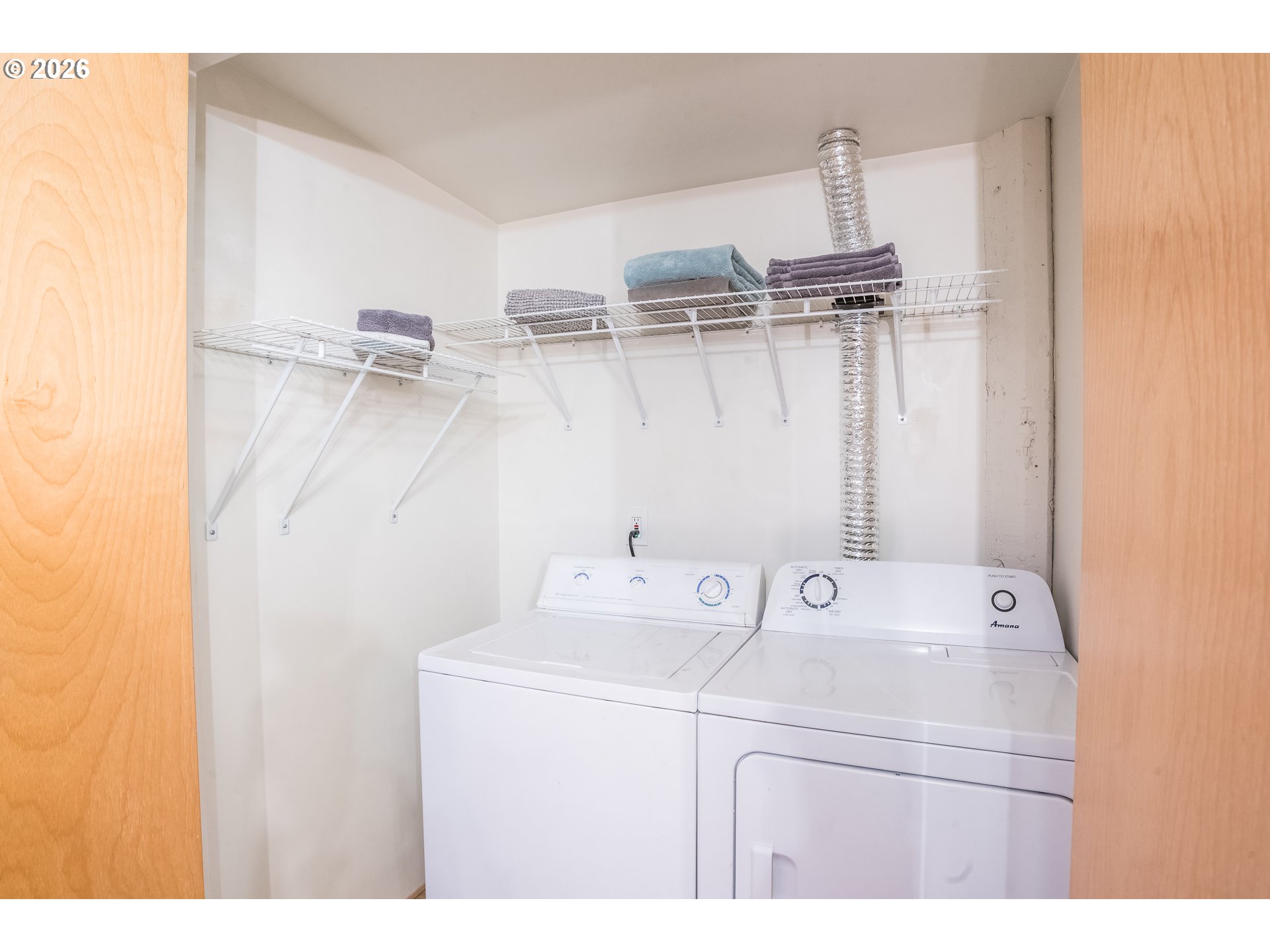 1420 Northwest Lovejoy Street, Unit 417 Portland, OR 97209 - Photo 31 of 40 a utility room with dryer and washer