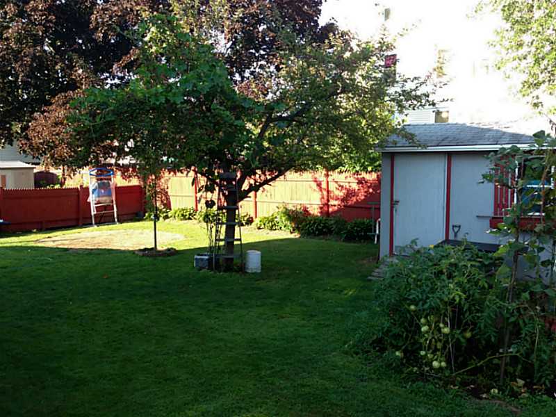 295 9th Avenue Woonsocket, RI 02895 - Photo 3 of 23 Exterior Front. Well manicured yard