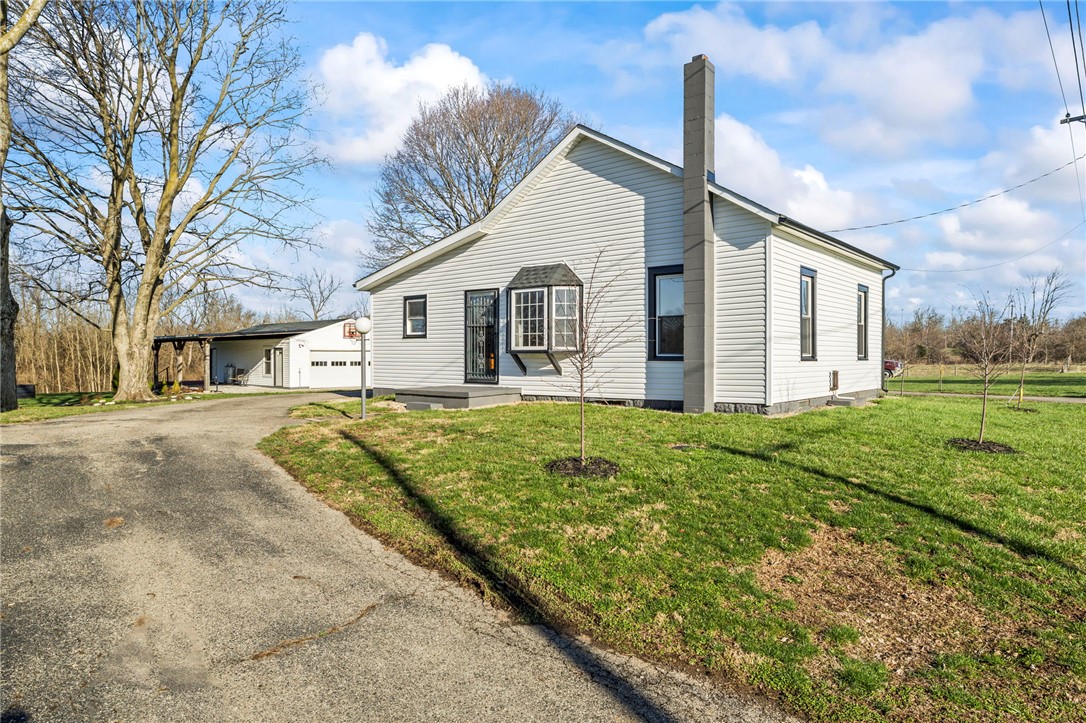 10797 Gratis Jacksonburg Road Somerville, OH 45064 - Photo 3 of 27 This charming home features classic siding, a driveway, and ample yard space under a bright sky.