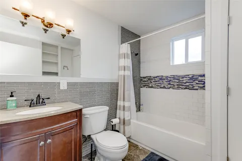 a bathroom with a sink a toilet and a bathtub