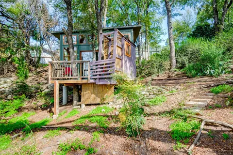a view of a house with roof deck front of house