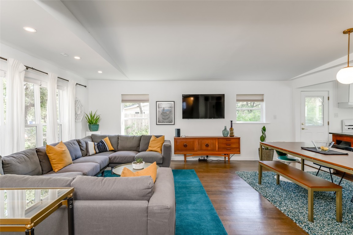 5323 Downs Drive Austin, TX 78721 - Photo 2 of 23 a living room with furniture and a flat screen tv