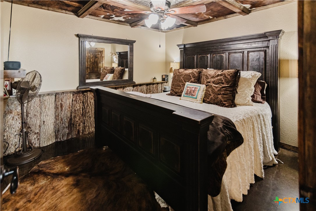 1440 Old Goliad Road Cuero, TX 77954 - Photo 11 of 41 a bedroom with a bed and a mirror
