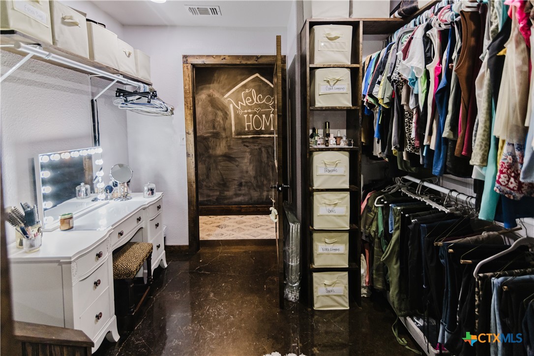 1440 Old Goliad Road Cuero, TX 77954 - Photo 14 of 41 a view of walk in closet with clothes and shoes
