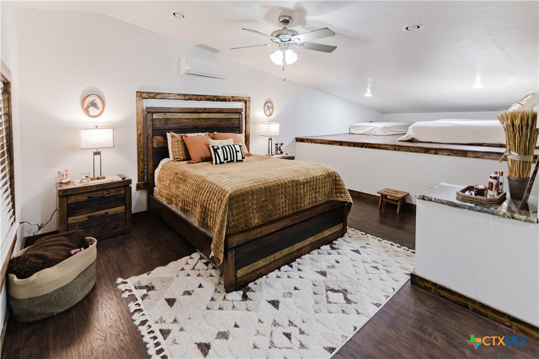 1440 Old Goliad Road Cuero, TX 77954 - Photo 21 of 41 a bedroom with a bed and ceiling fan
