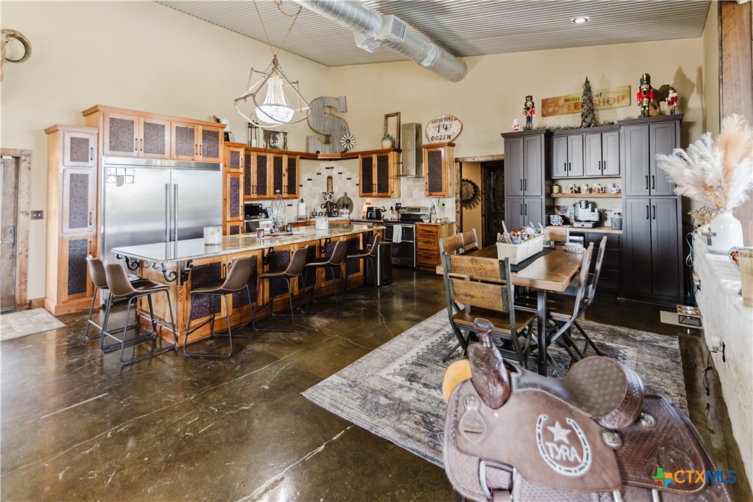 1440 Old Goliad Road Cuero, TX 77954 - Photo 5 of 41 a living room with lots of chairs and refrigerator