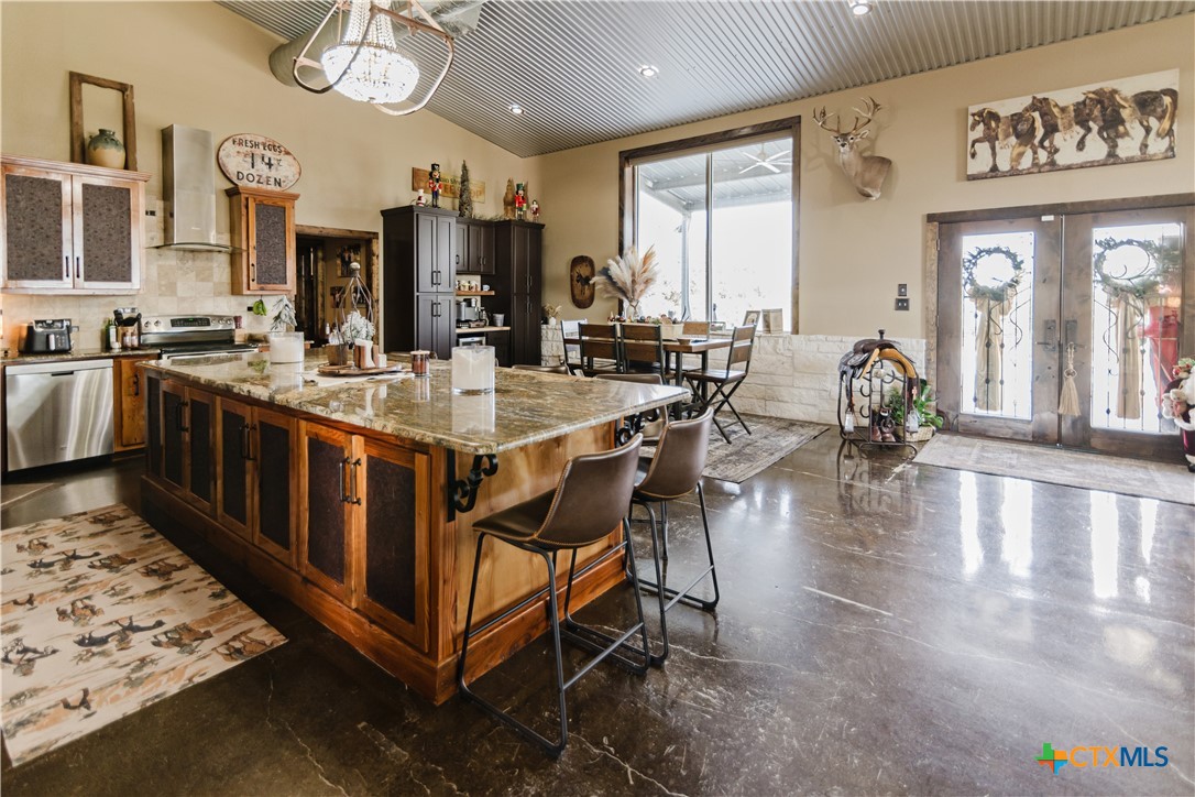1440 Old Goliad Road Cuero, TX 77954 - Photo 6 of 41 a large kitchen with lots of counter space and glass door