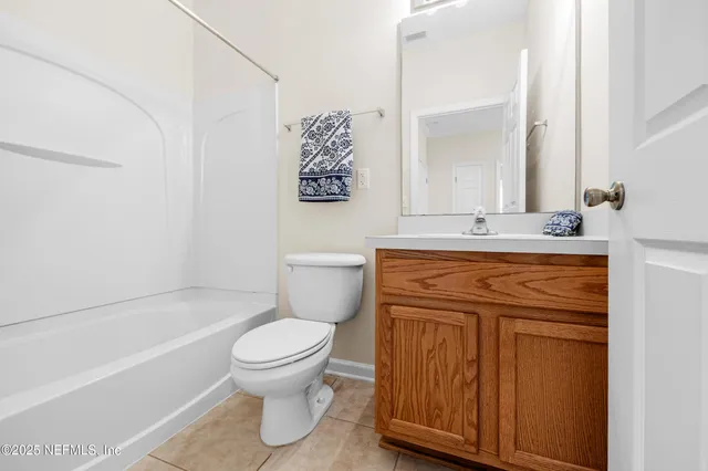 a bathroom with a sink a toilet and a bathtub
