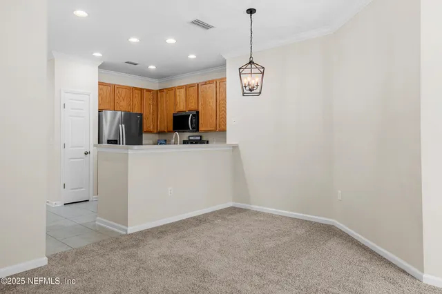 a view of a kitchen with a sink and dishwasher