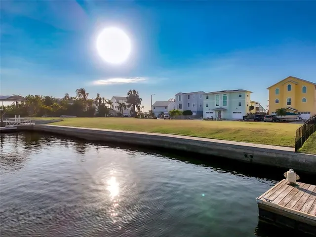 a view of swimming pool with outdoor seating and yard in back