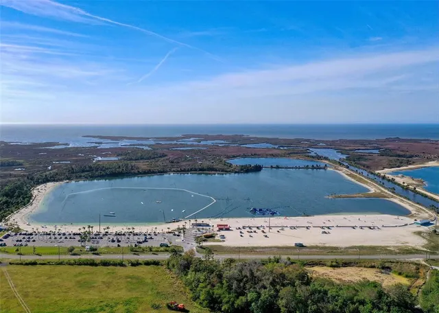 an aerial view of a house with a lake view