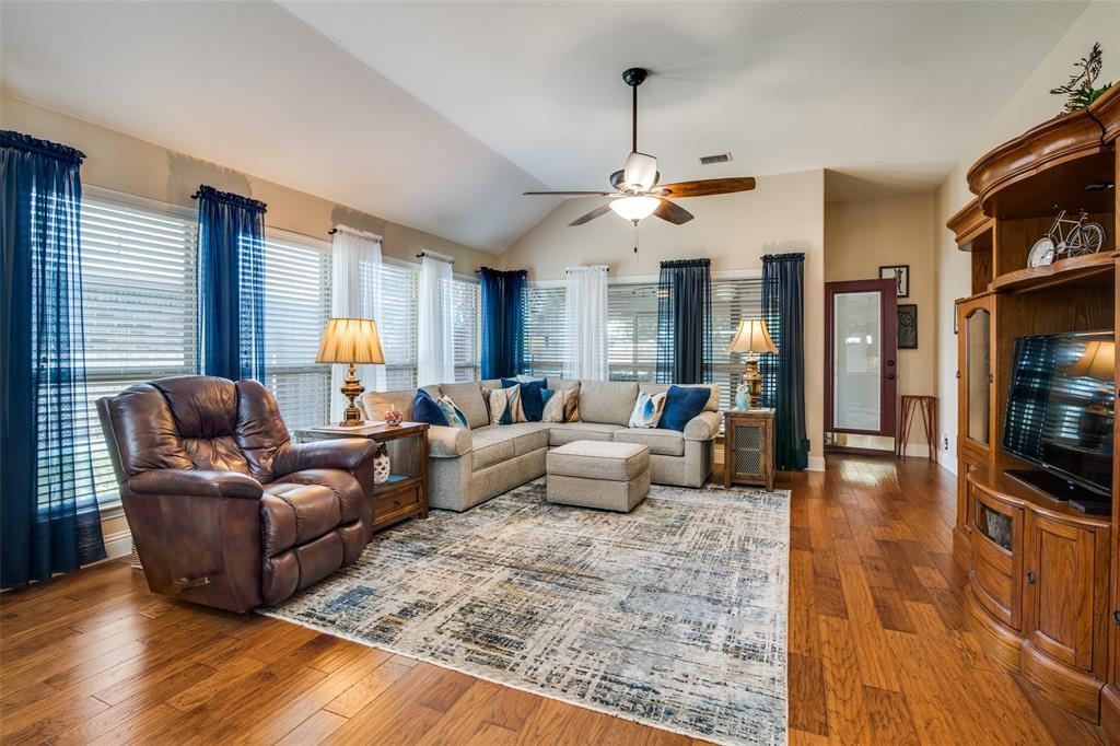 1036 Glenn Road Lavon, TX 75166 - Photo 11 of 30 a living room with furniture kitchen view and a wooden floor