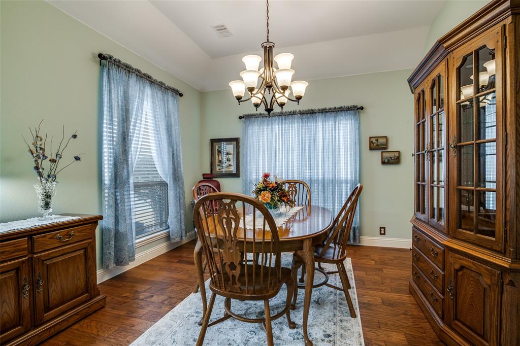 1036 Glenn Road Lavon, TX 75166 - Photo 4 of 30 a view of a dining room with furniture window and wooden floor
