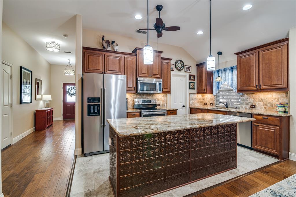1036 Glenn Road Lavon, TX 75166 - Photo 5 of 30 a kitchen with stainless steel appliances granite countertop a sink stove and refrigerator