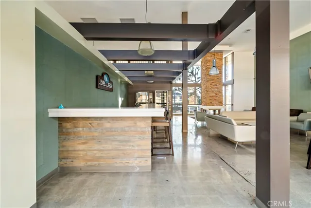 a living room with furniture a window and a table