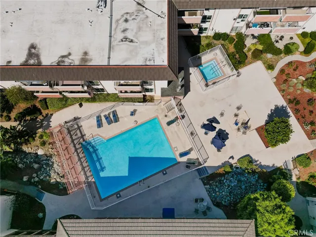 an aerial view of a house with a swimming pool