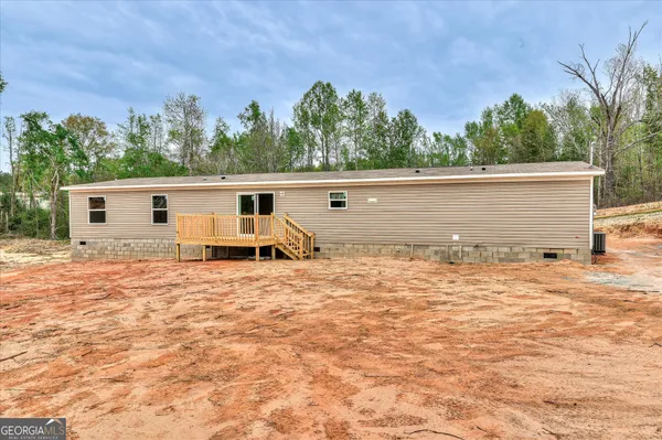 a view of a back yard of the house