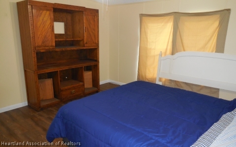 9700 Luther Beck Road Hastings, FL 32145 - Photo 11 of 20 a bedroom with a bed and a window